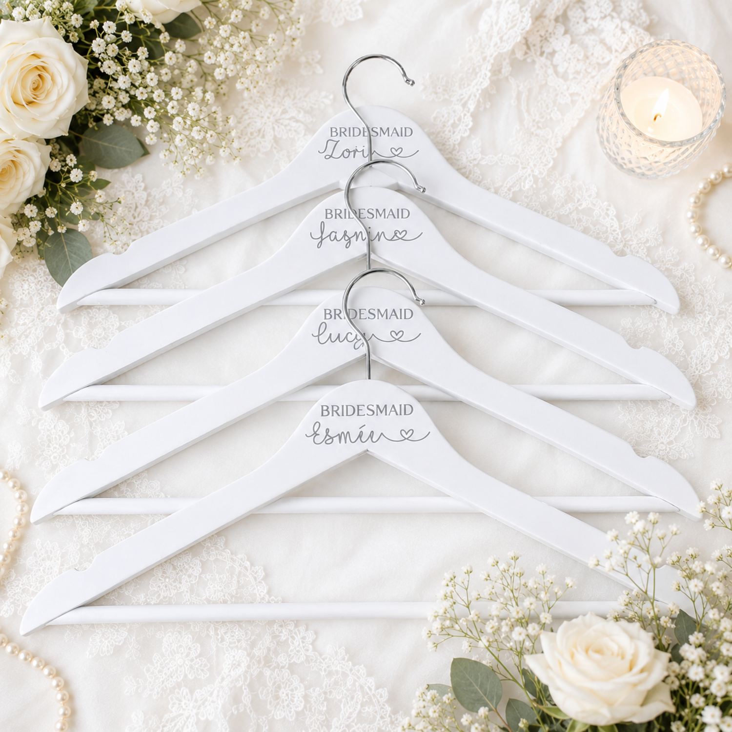 Elegant personalised white wooden wedding hanger with custom name and role, available for bride, bridesmaid, flower girl and mother of the bride in any writing colour.