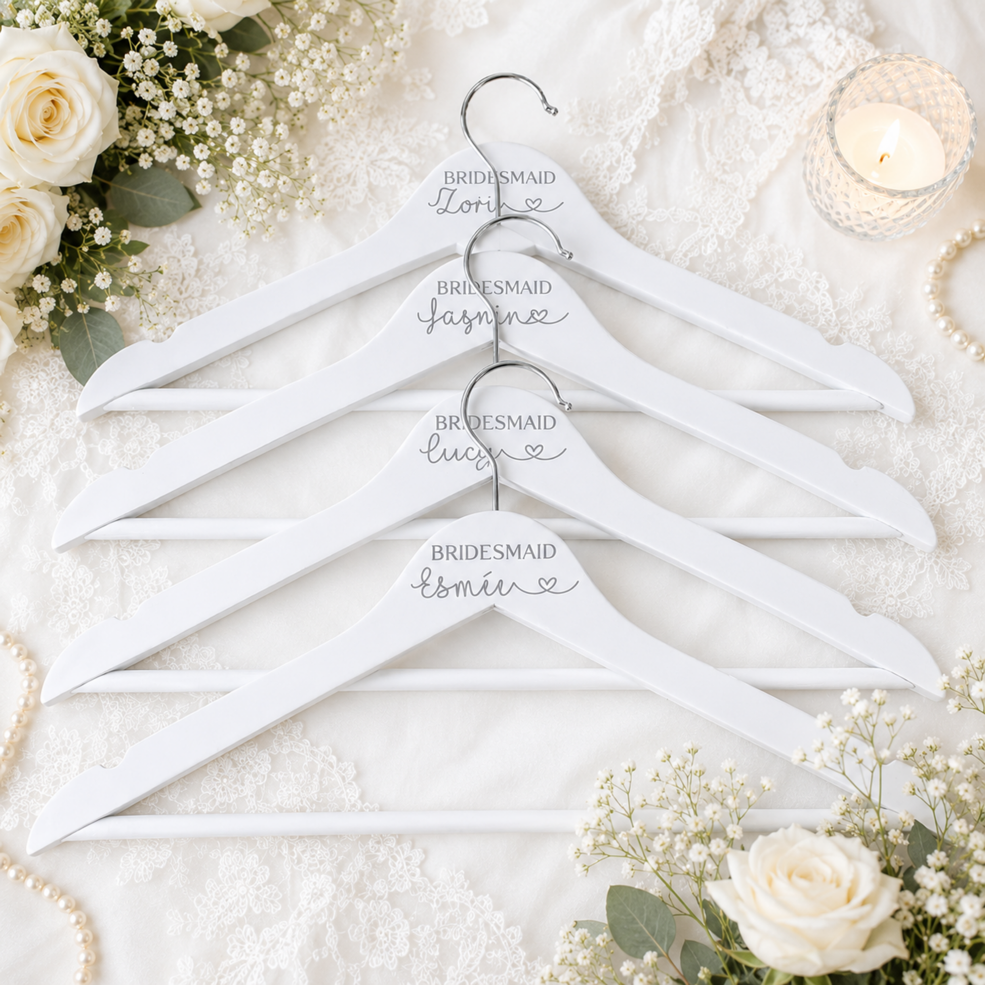 Elegant personalised white wooden wedding hanger with custom name and role, available for bride, bridesmaid, flower girl and mother of the bride in any writing colour.